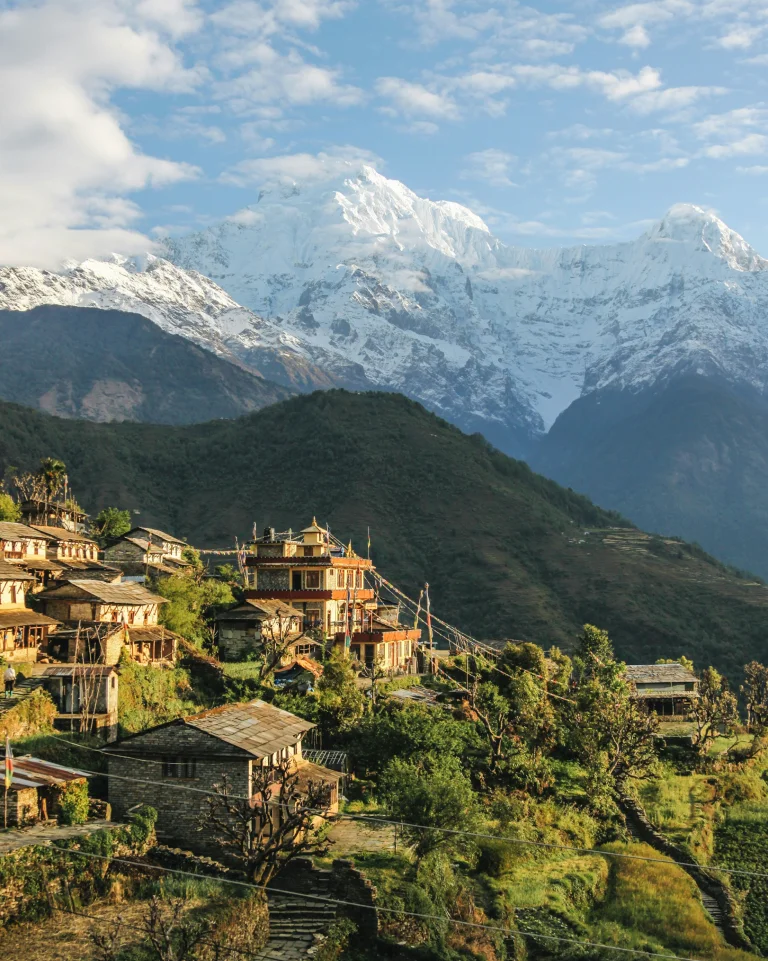 Pokhara, Nepal; The Pulse of Annapurna Region Trekking 5 Lush green forests surrounding the majestic mountains in Pokhara, Nepal, under a clear blue sky