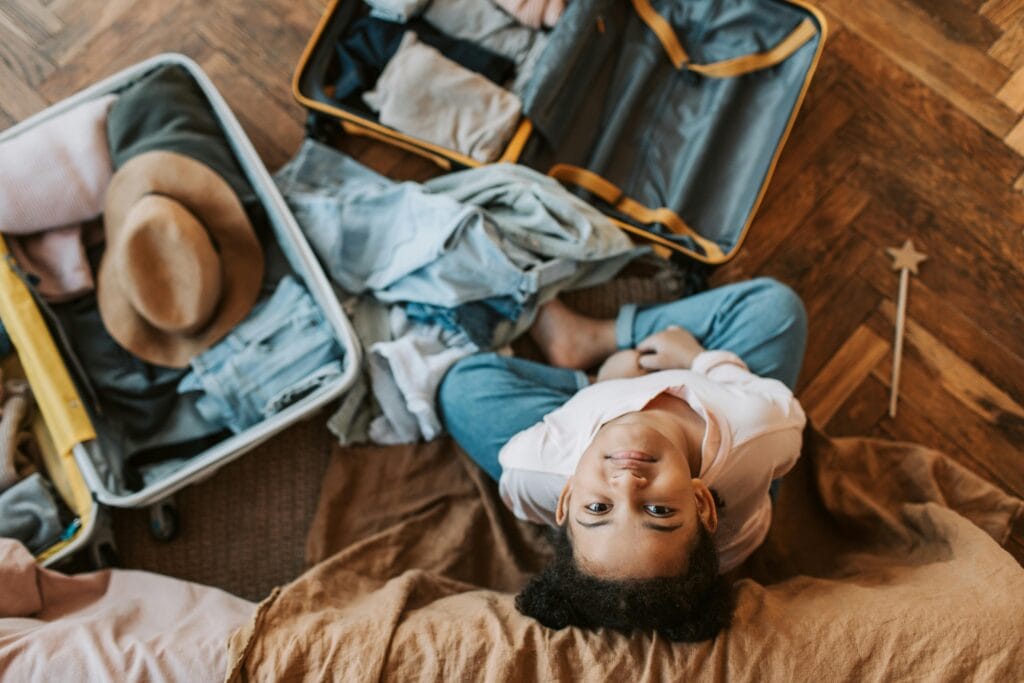 A girl packing the suitcase